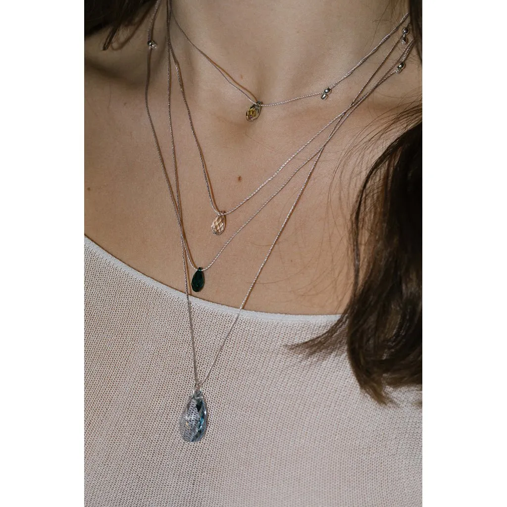 &Livy : Hyevibe Crystal Silk Slider Necklace in Smoked Amber
