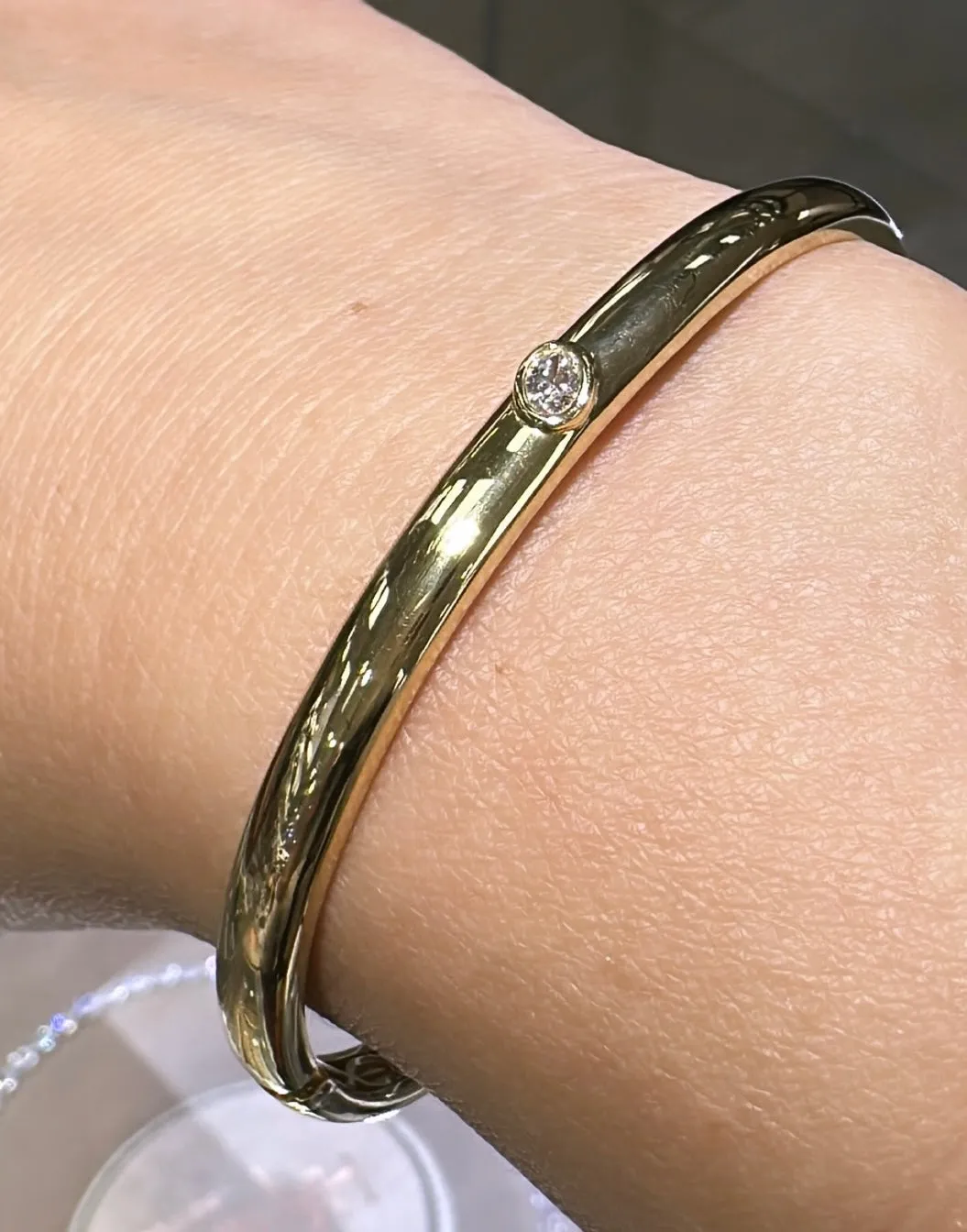 Burnish Set Oval-cut Off-center Set Diamond Bangle Bracelet