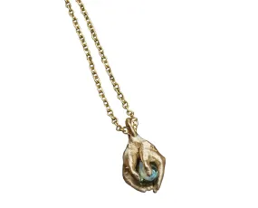 Hands with Green Sapphire Pendant