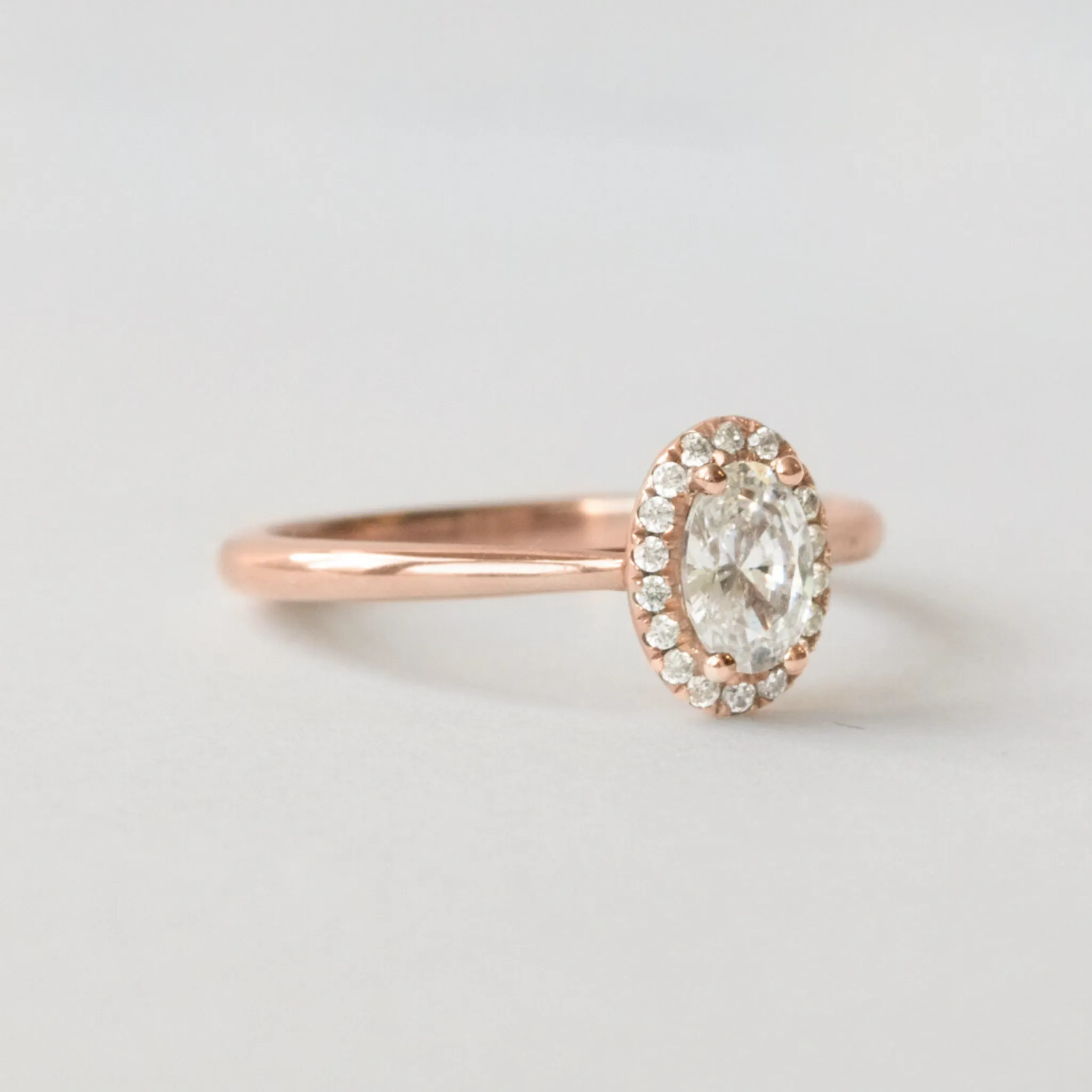 Oval Halo Engagement Ring in Rose Gold