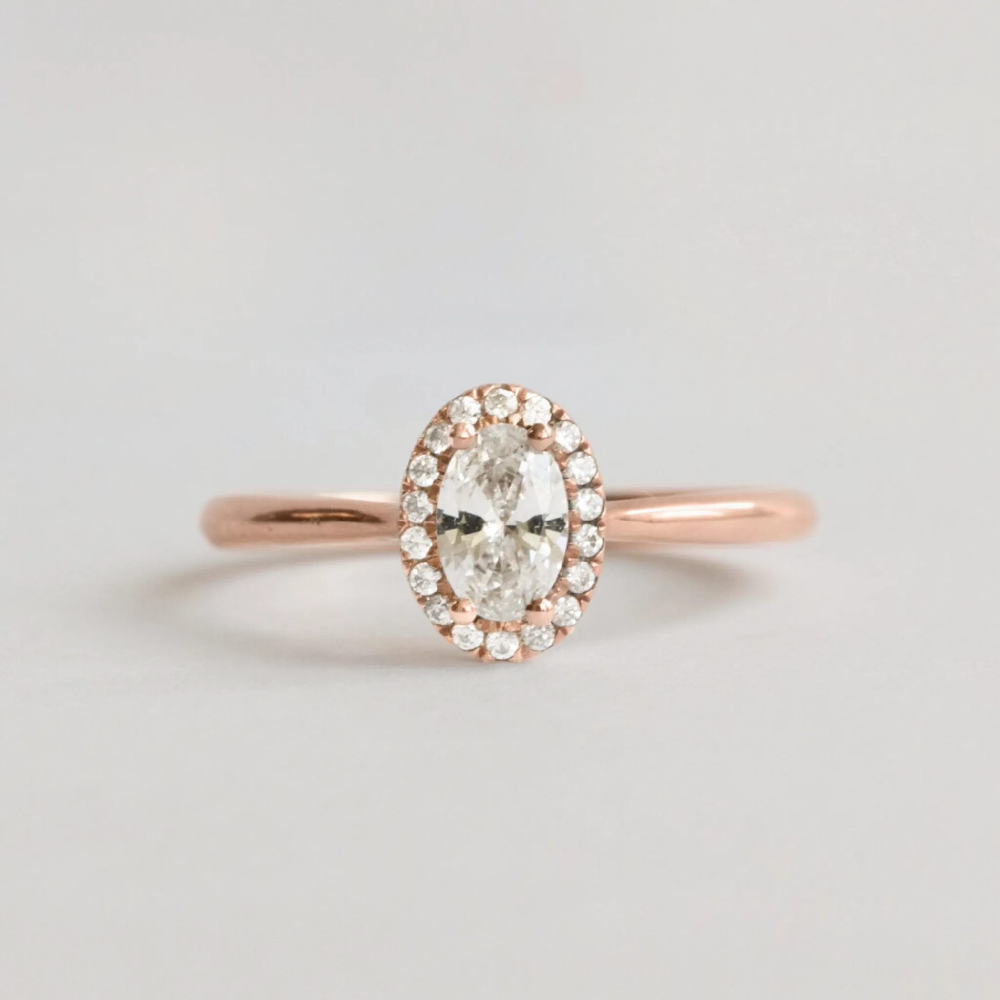 Oval Halo Engagement Ring in Rose Gold