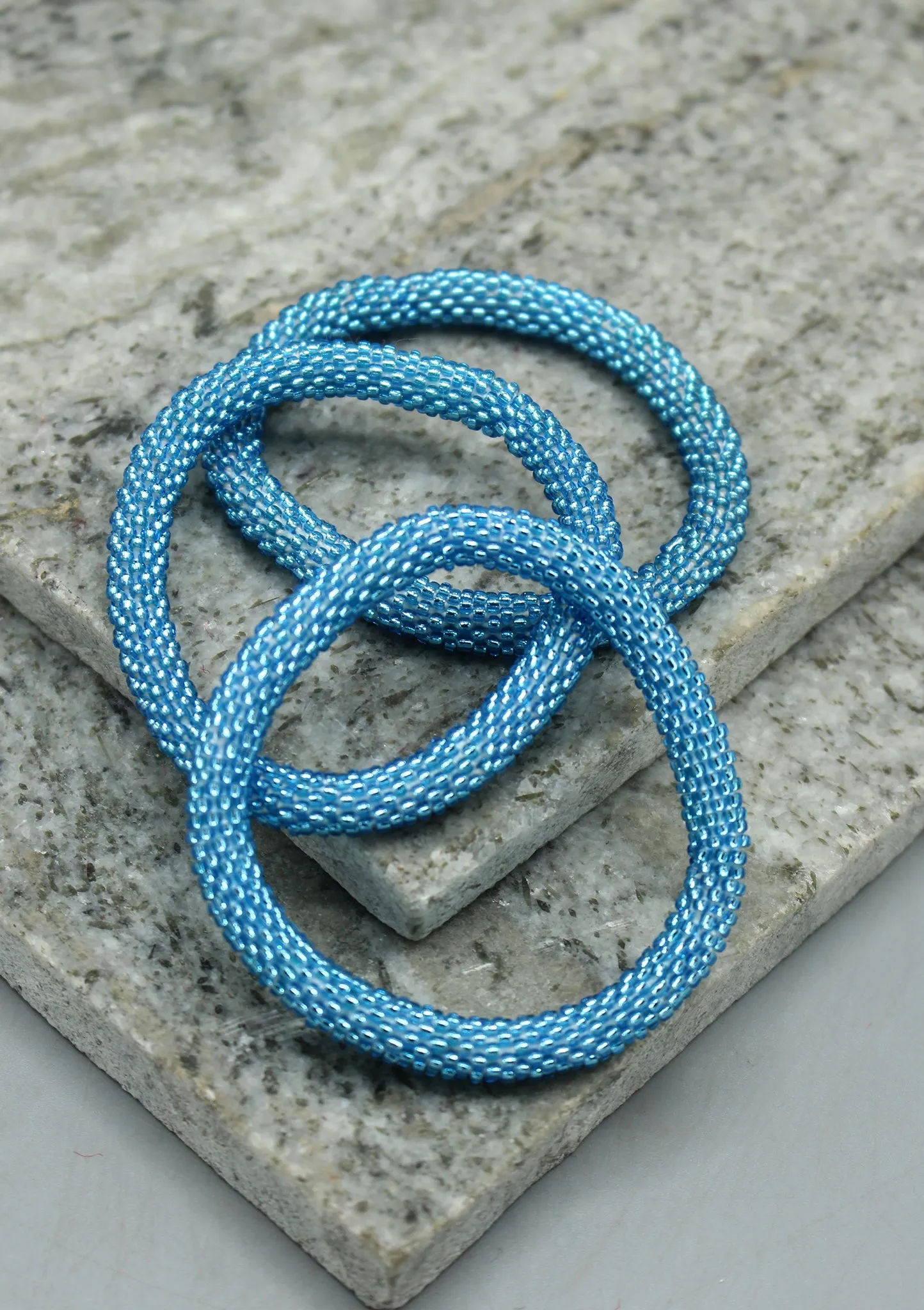 Shiny Blue Beads Nepalese Roll on Bracelet